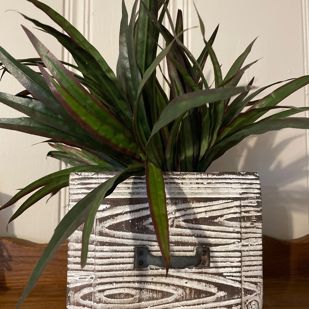 Antique weighted decor with greenery